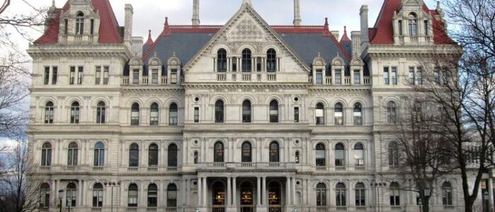 2019-New-York-State-Capitol-northwest-facade-Albany-New-York Historic building with red roofs and ornate facade.