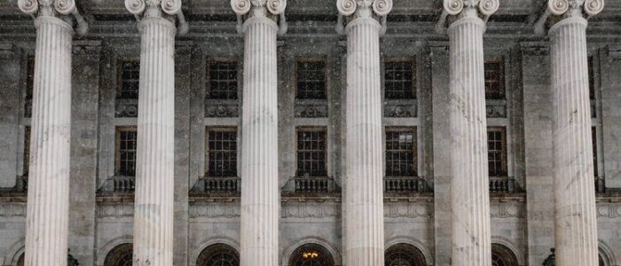 A-New-Way-to-Avoid-Mandatory-Minimum-Sentences Snowy courthouse with tall columns and steps.